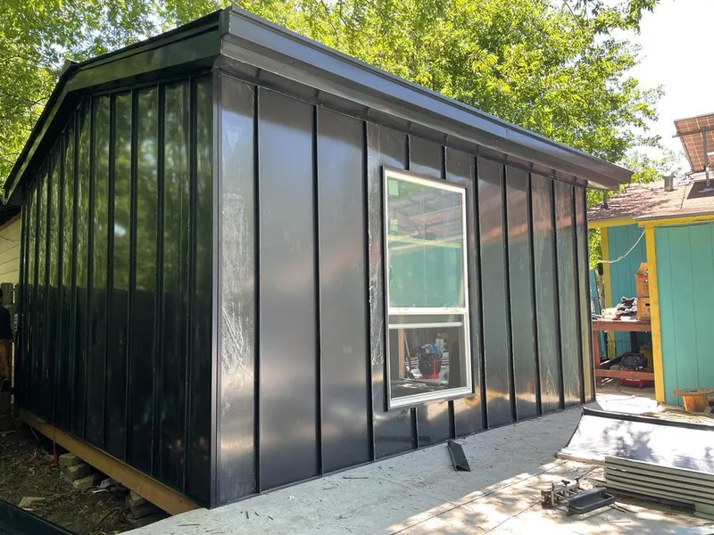 Black standing seam metal wall panels for Roof Inspection in Severance